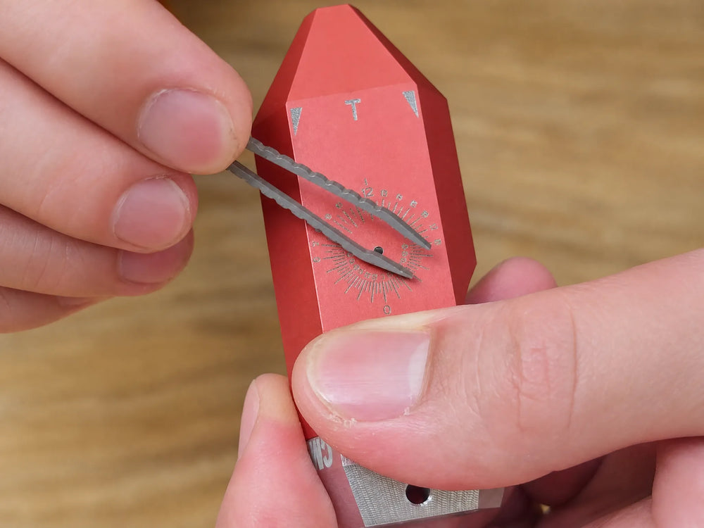 Close-up of compass dial with magnetic needle and laser-engraved markings